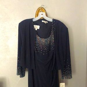 Womens sleeveless full length navy dress with beaded detail.